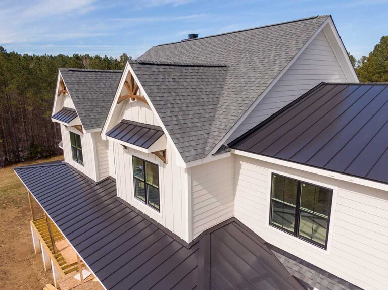 Close view of curled and cracked asphalt shingles with loose granules along a roof edge. KEYWORDS: ["curled asphalt shingles", "cracked roof shingles", "residential roof inspection"]